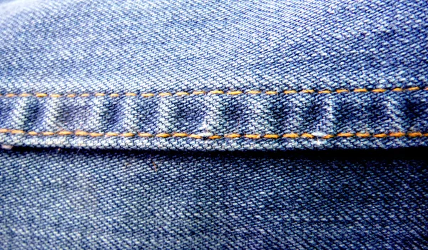 Textuur van blauwe jeans achtergrond — Stockfoto