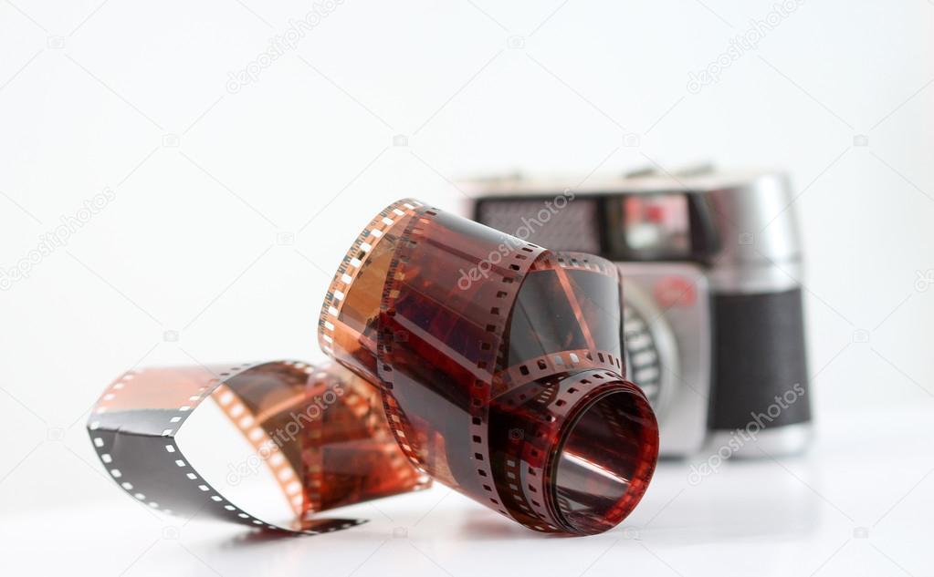 vintage camera film roll on white background