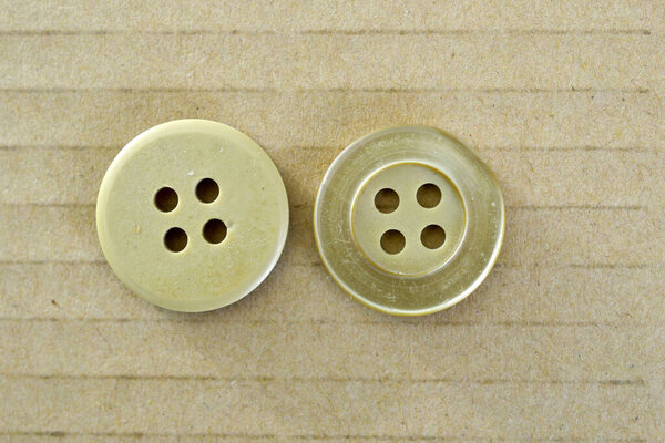 close up image of sewing button.