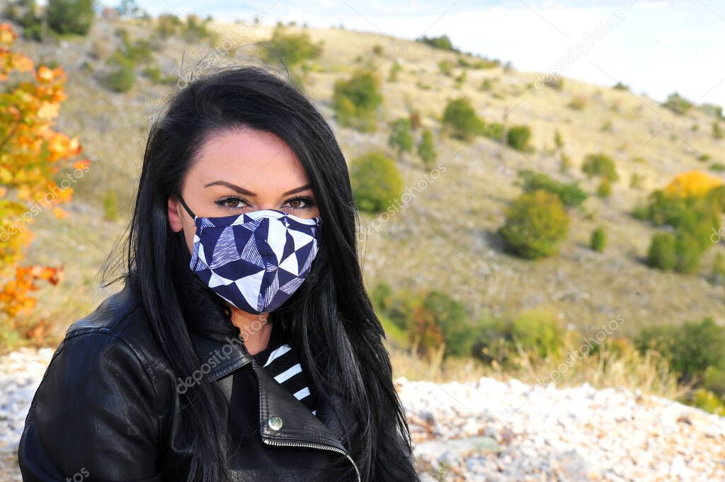 Woman wearing face mask because of protecting of virus.