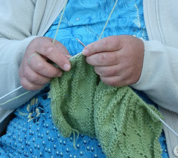 Woman knitting wool