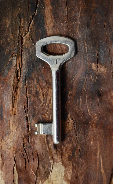 Key on a wood — Stock Photo, Image