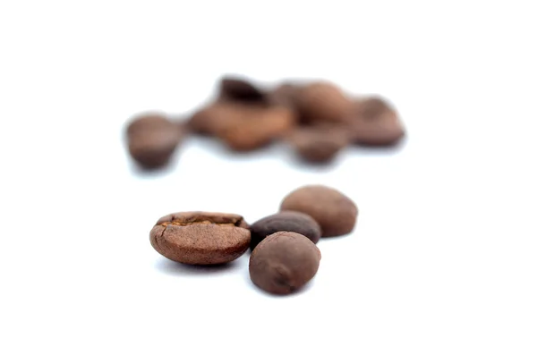 Roasted coffee beans and solated on a white background — Stock Photo, Image