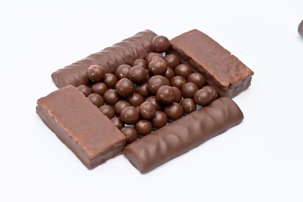 Bolas e barras de chocolate de cereais — Fotografia de Stock