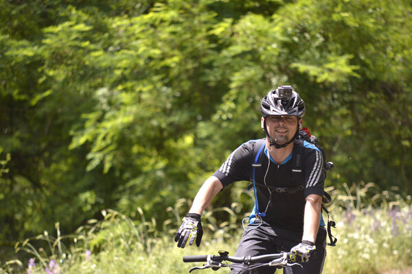NATIONAL PARK GALICICA, MACEDONIA -JUNE 21, 2015: Bicycle Tour "Tour de Galichitsa" was organized by the cycling-Mountain Bike Club Prespa. Тур проводится второй год, участники имели возможность
