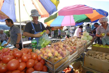 Fruit and vegetable sellers at the market clipart