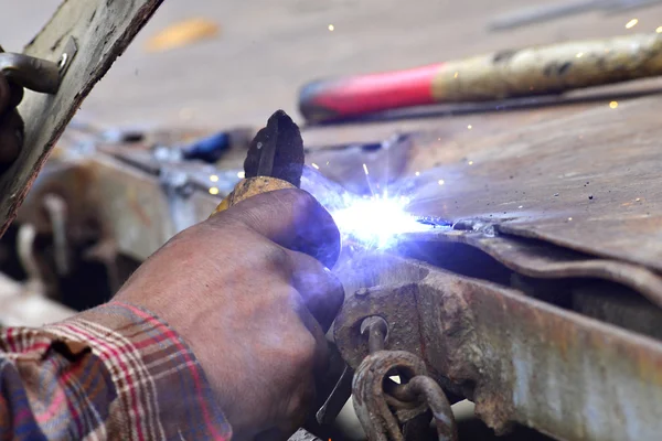 Dangerous welding without protective work wear — Stock Photo, Image