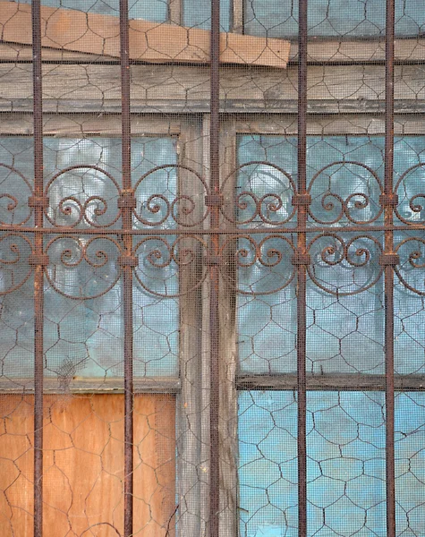 Old wood window with rusty metala decor — Stock Photo, Image