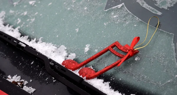 Christmas decor on a  car wiper with frost — Stock Photo, Image