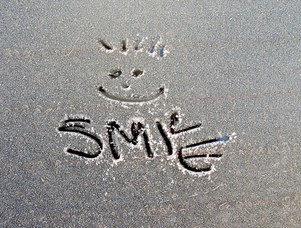 Text smile  on frost car window — Stock Photo, Image