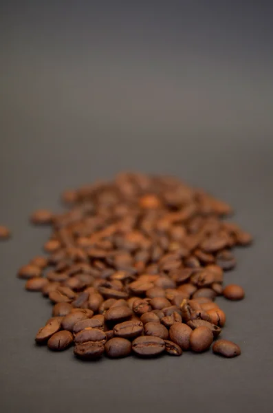 Roasted coffee on  brown background — Stock Photo, Image