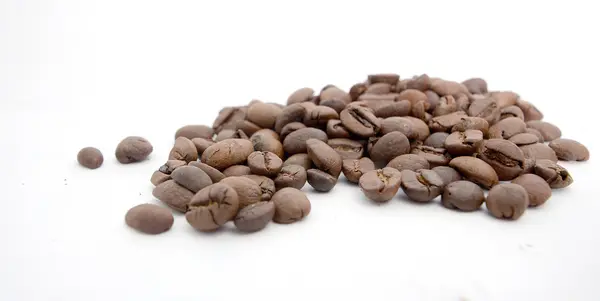 Roasted coffee beans on white background — Stock Photo, Image