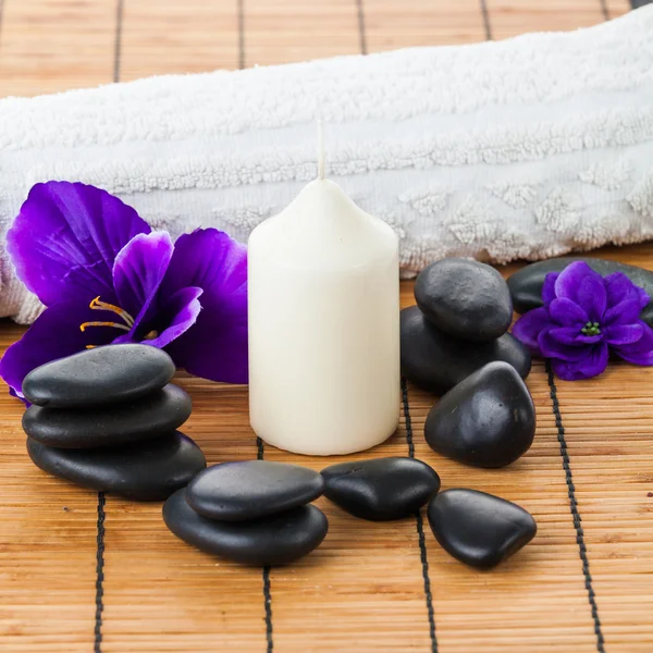 Zen stones, candle and flowers — Stock Photo, Image