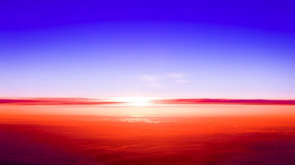 Západ slunce nad mraky z okna letadla — Stock fotografie