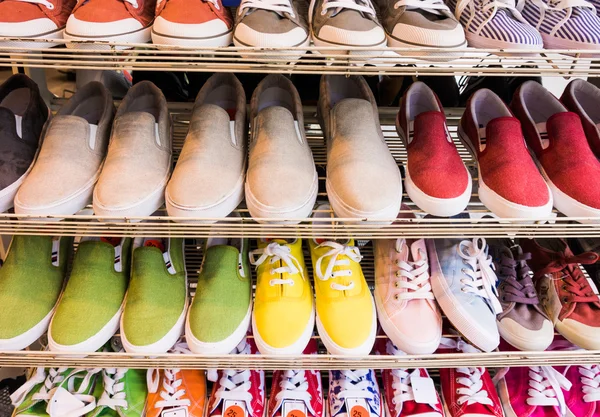 Lots of  shoes on sale.  Diverse shoes — Stock Photo, Image