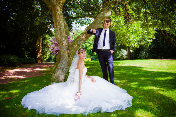 Couple posing in garden