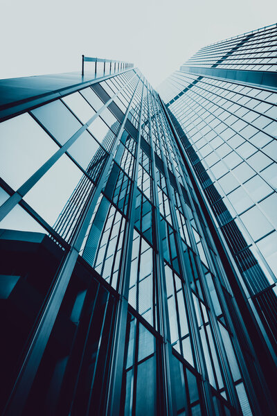Blue skyscraper facade. Office buildings. Modern glass silhouettes of skyscrapers