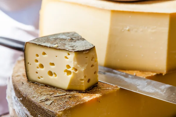 Tasty Cheese and knife — Stock Photo, Image