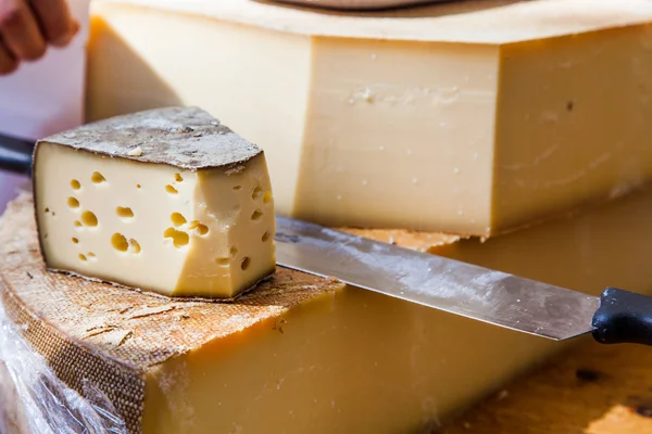 Tasty Cheese and knife — Stock Photo, Image