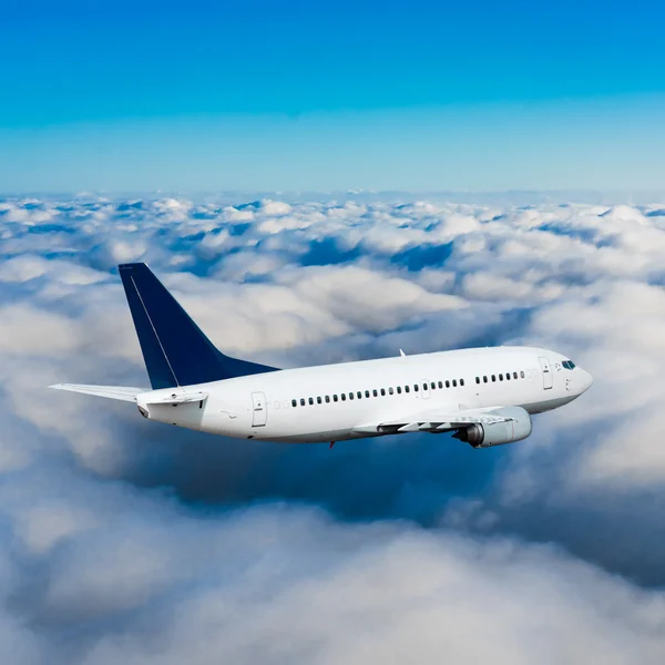 Passenger airplane flying Stock Image