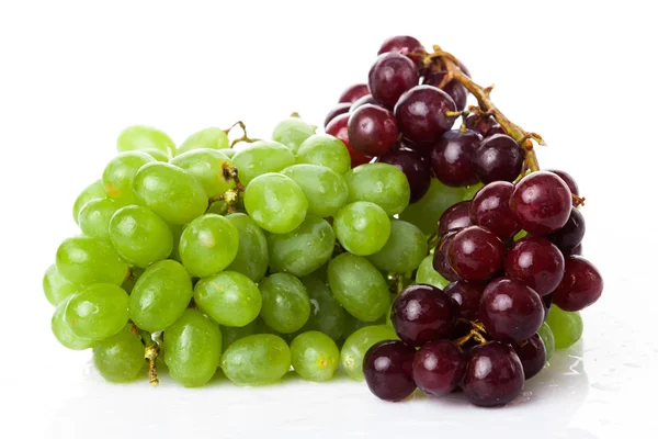 Rose and green grapes — Stock Photo, Image