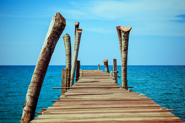 Wooden pier over blue sea water