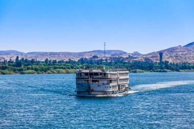 Touristic cruiser on the river Nile. clipart