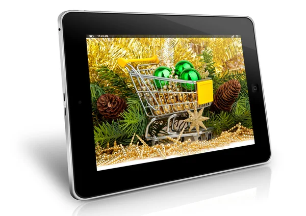 Carrito de compras en pantalla tablet . Imagen de archivo