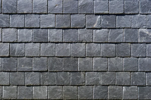 Vierkante platen van een zwarte fragiele steen — Stockfoto