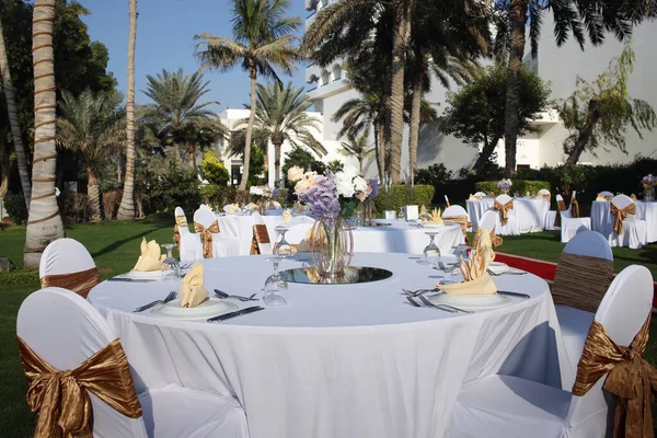 Dinner tables set in the  park