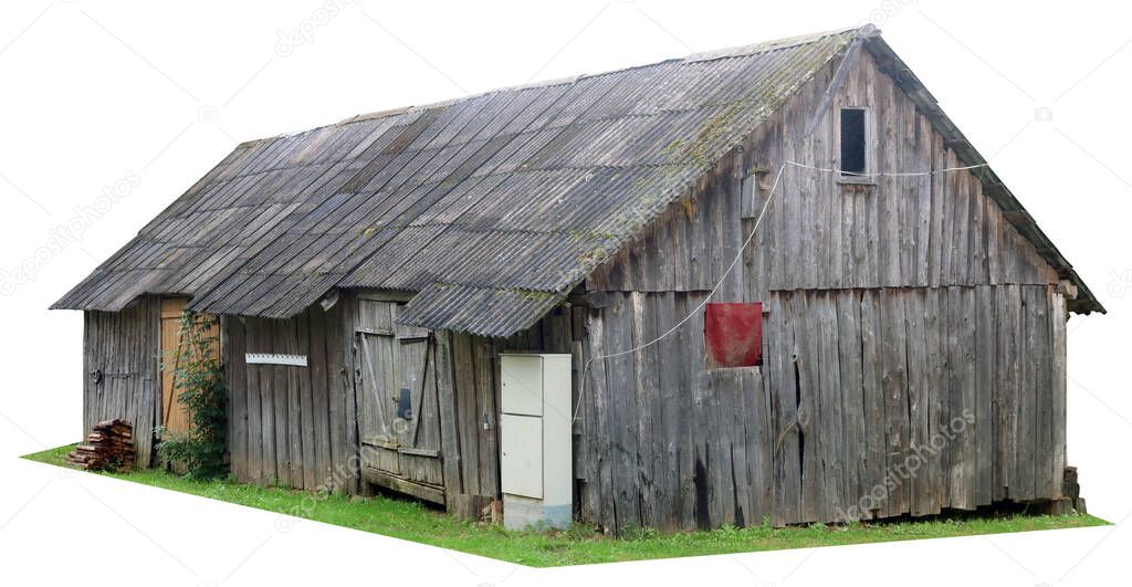 Aged  wooden vintage  rural barn for storage of firewood and agricultural tools. Isolated on white