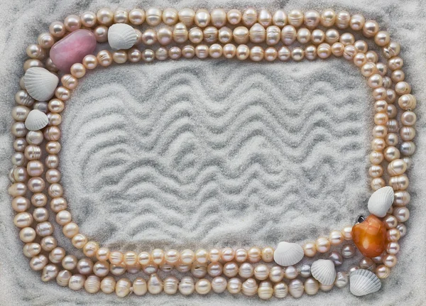 Pearls on white sea sand concept — Stock Photo, Image