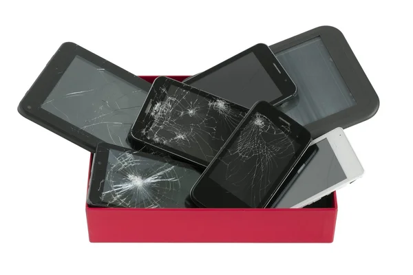 Dispositivos quebrados na caixa vermelha — Fotografia de Stock