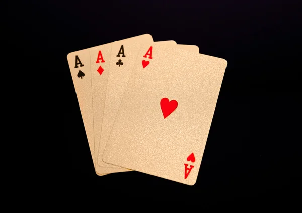 Golden playing cards four aces on black background — Stock Photo, Image