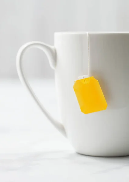 Teabag Yellow Blank Tag Black Tea White Porcelain Cup White — Stock Photo, Image