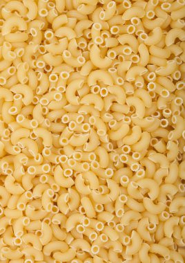 Taze çiğ klasik Maccheroni dirsekli makarna ias doku arka planı. Üst görünüm