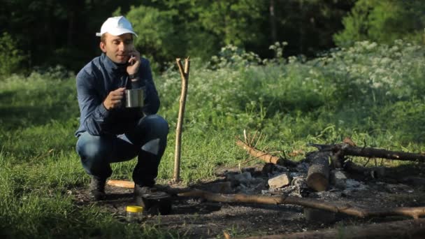 Man call by smartphone in camping — Stock Video