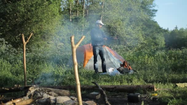 Man making selfie by smartphone in camping — Stock Video