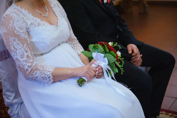 Bride and groom at church wedding during ceremony. Beautiful decoration