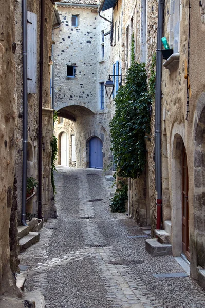 Street with a gate in the medieval village of Rochemaure Stock Picture