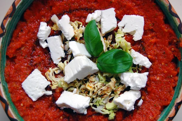 Fresh tomato sauce with basil leaves and goat cheese in ceramic — Stock Photo, Image