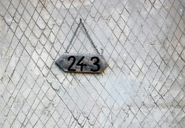 Sayı asılı duvar ev — Stok fotoğraf