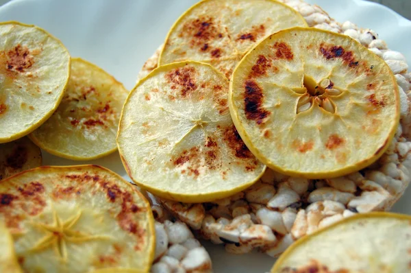 Healthy food, rice crackers with baked apples chips — Stock Photo, Image