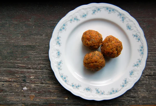 Carrot truffles with poppy seeds on plate — Stock Photo, Image