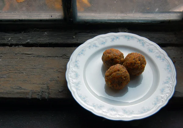 Carrot truffles with poppy seeds on plate — Stock Photo, Image