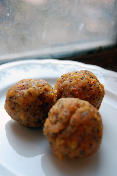 Carrot truffles with poppy seeds on plate — Stock Photo, Image