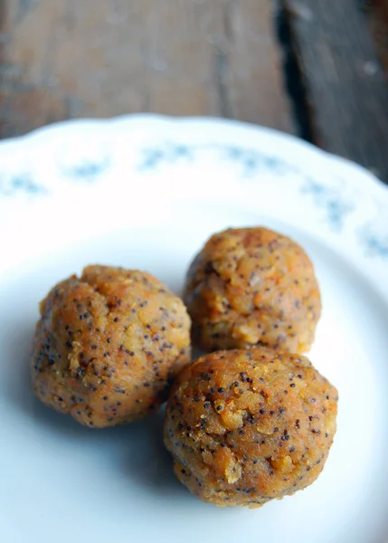 Carrot truffles with poppy seeds on plate — Stock Photo, Image