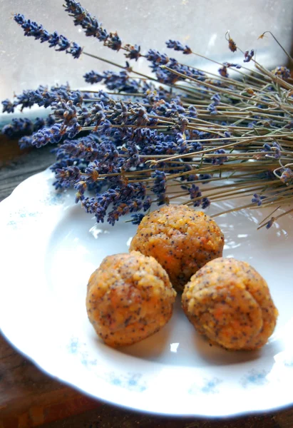 Carrot truffles with lavender on a plate — Stock Photo, Image