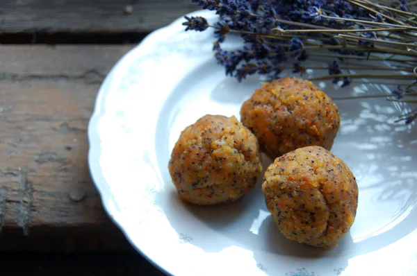 Carrot truffles with lavender on a plate — Stock Photo, Image