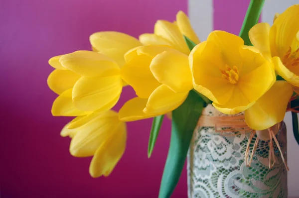 Yellow tulips in lace vase — Stock Photo, Image